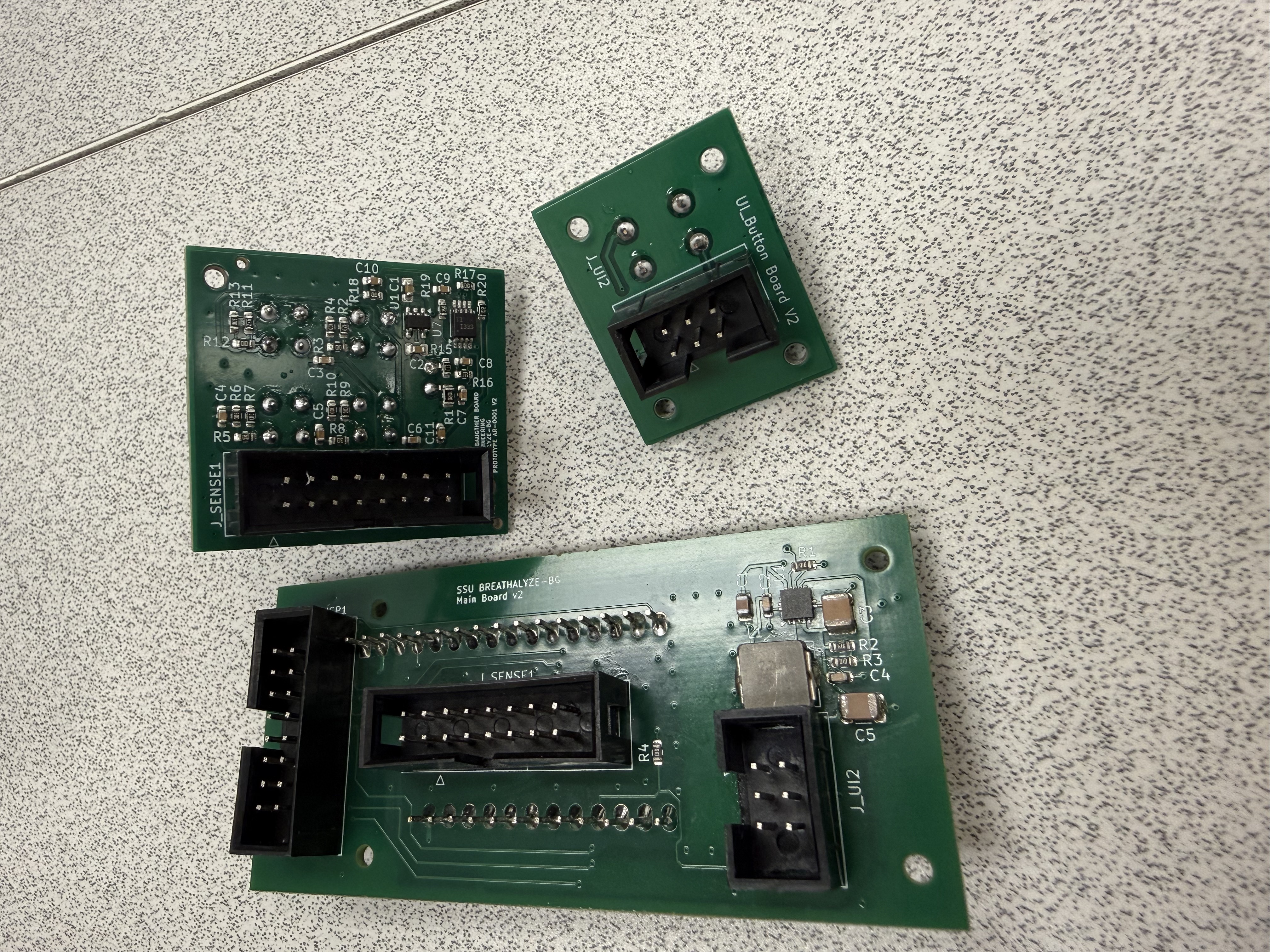 Rear view of the assembled main, sensor, and button circuit boards