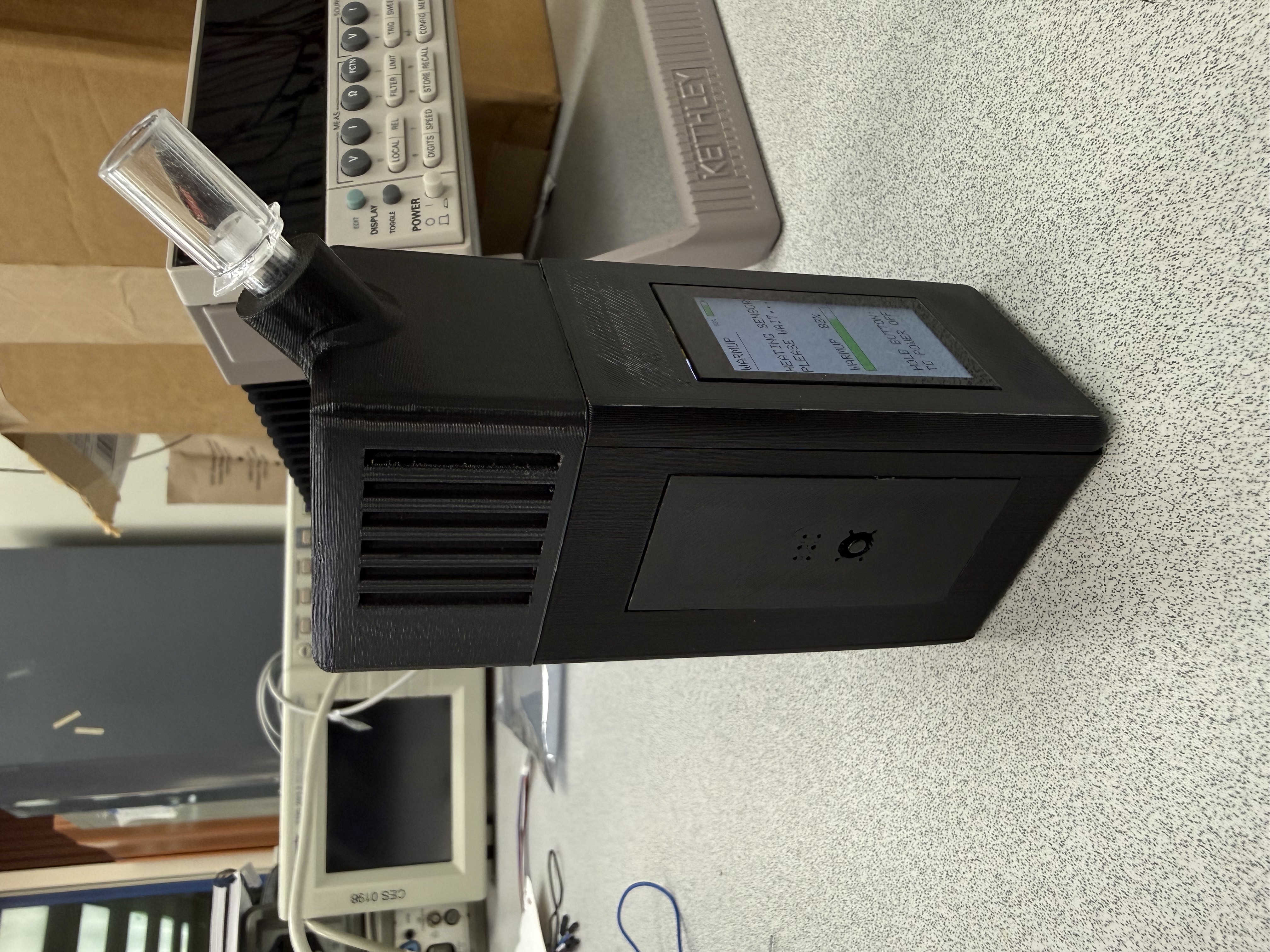 Completed black Breathalyze-BG prototype shown from the front and side
