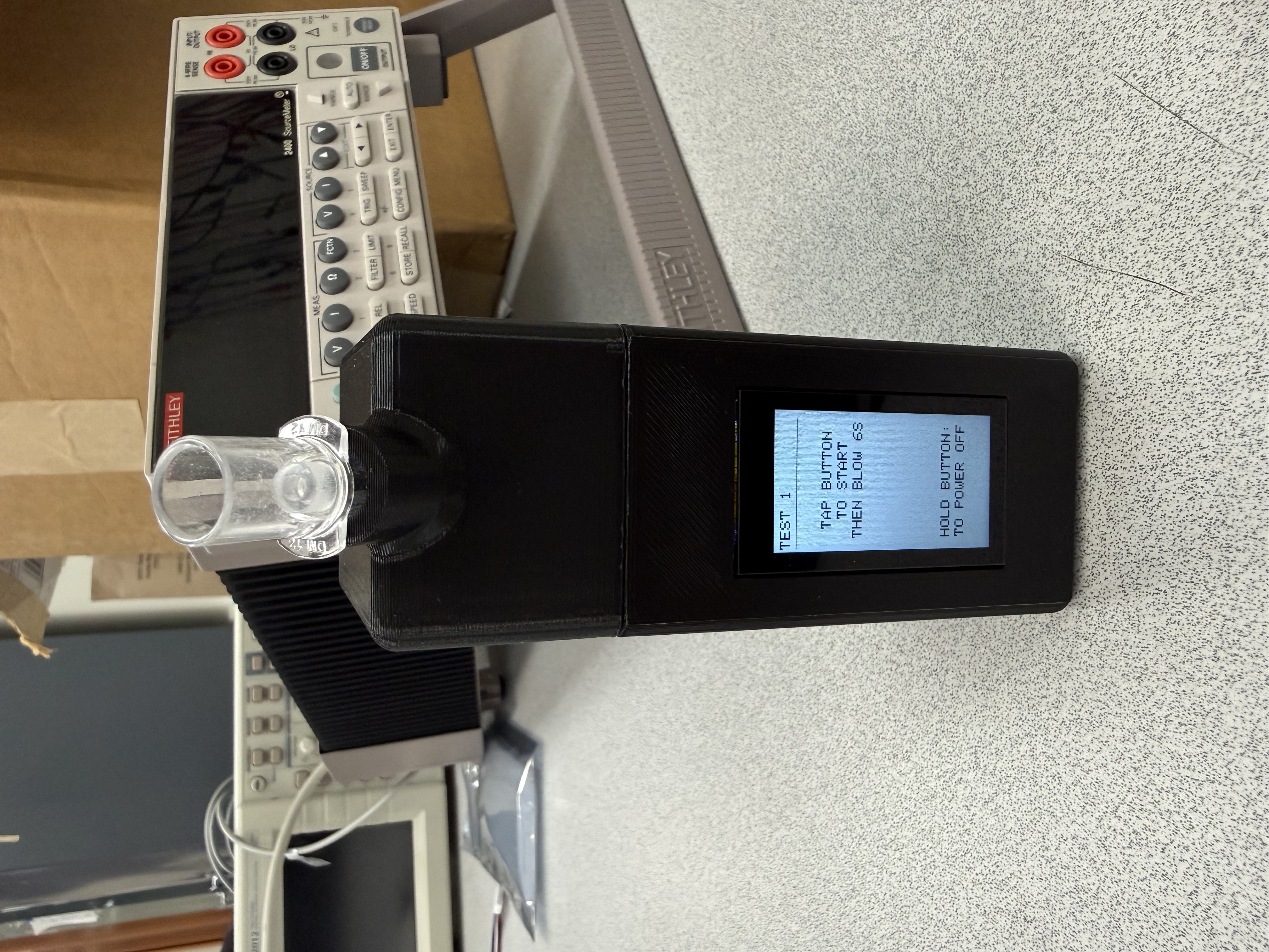 Completed black Breathalyze-BG prototype powered on