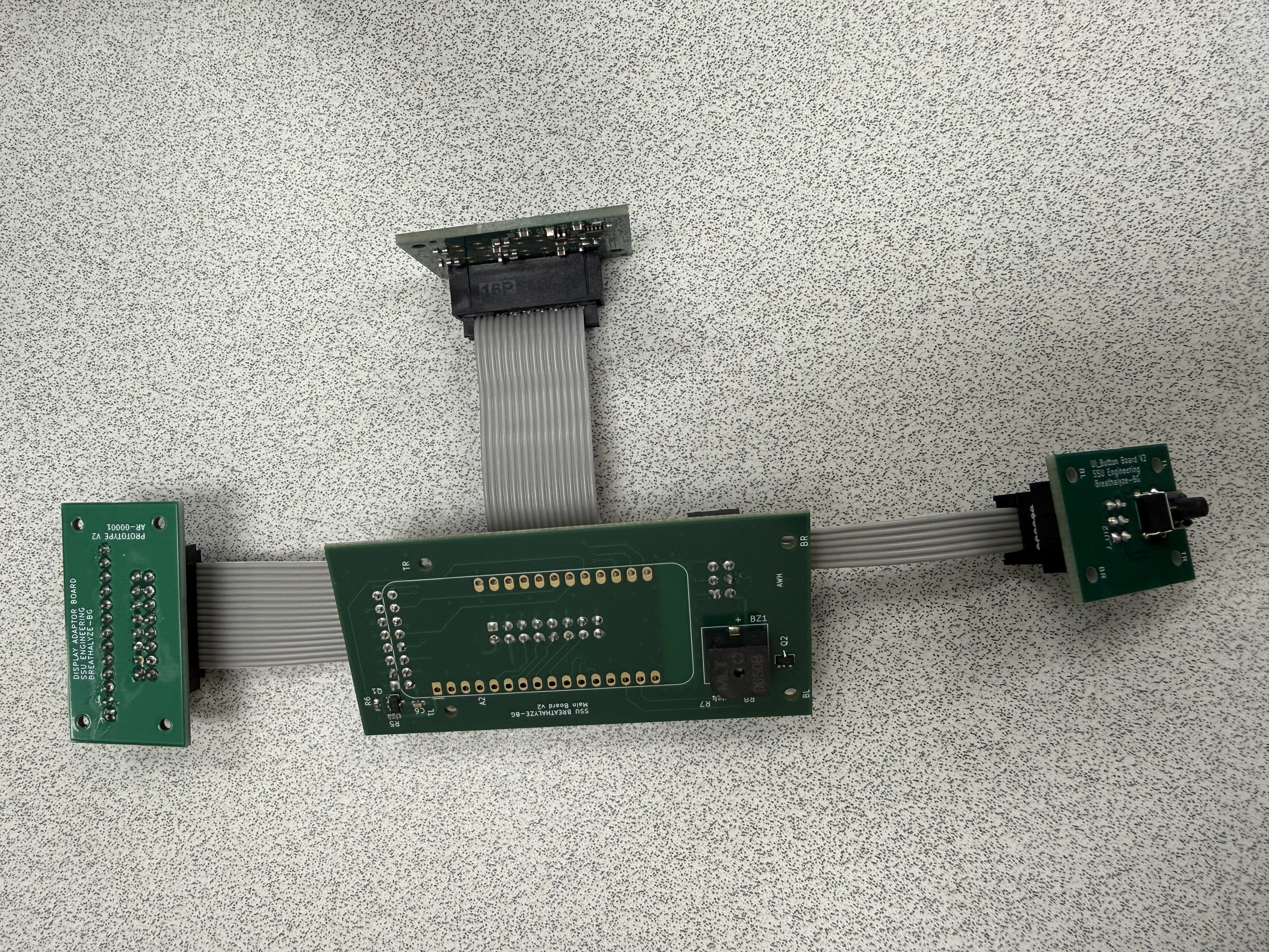 Four Breathalyze-BG circuit boards connected with ribbon cables as an integrated electronics assembly
