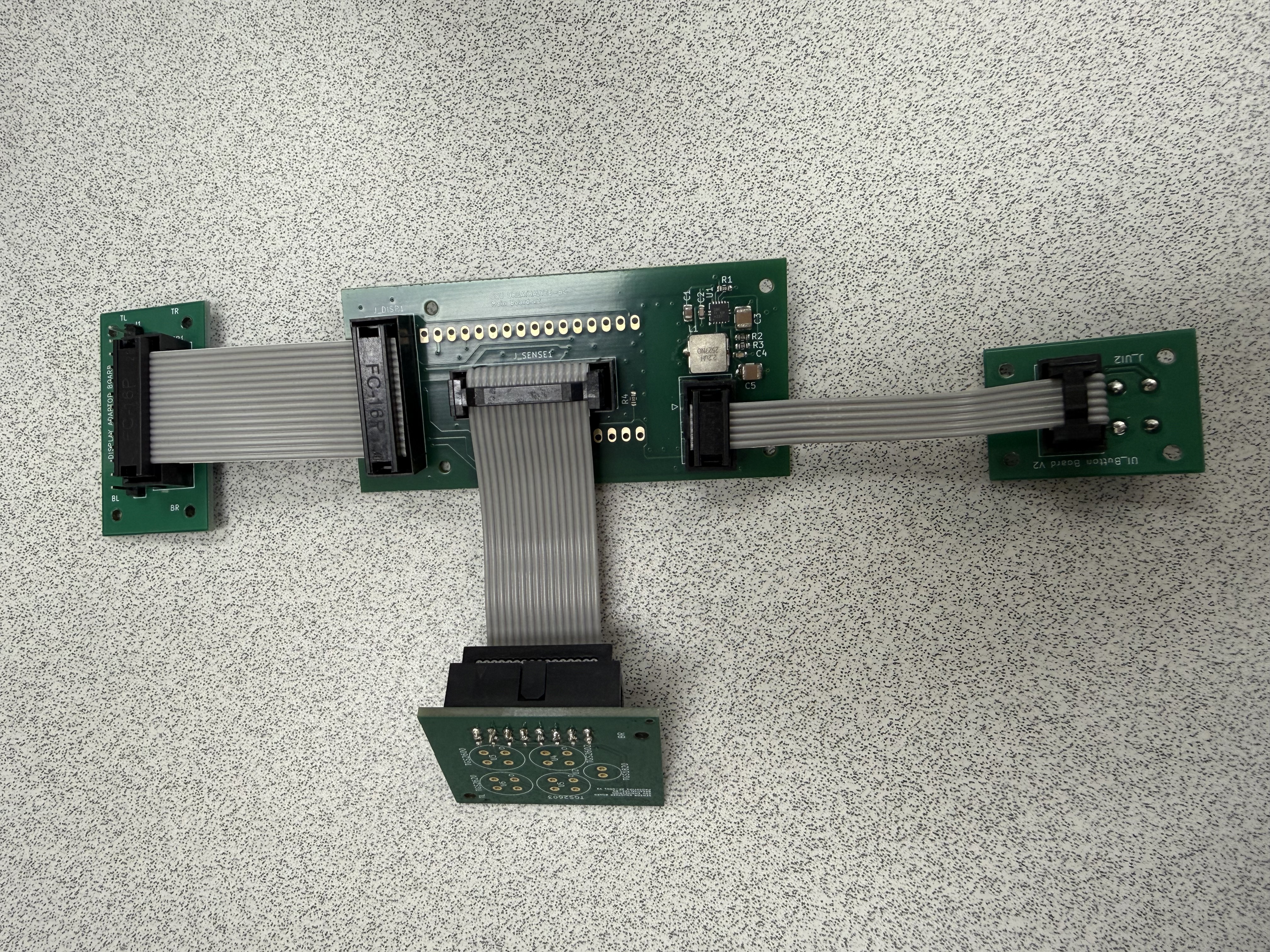 Connected electronics assembly laid out before enclosure installation